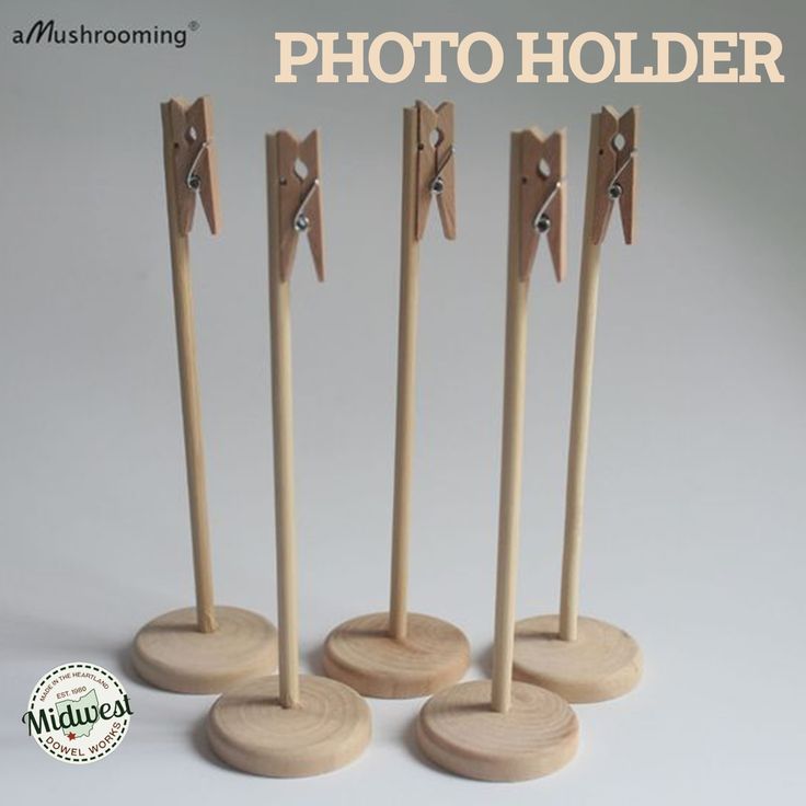 four wooden photo holders with one standing on the other and three in the same direction