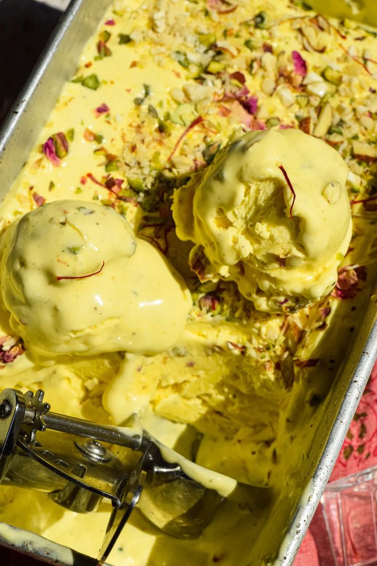 two scoops of ice cream in a metal pan