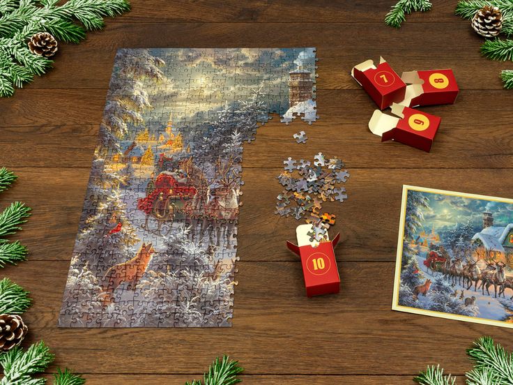 a wooden table topped with puzzle pieces and christmas decorations