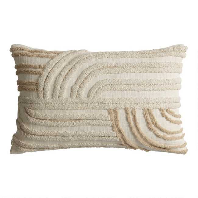 a white pillow with fringes on the front and back of it, against a white background