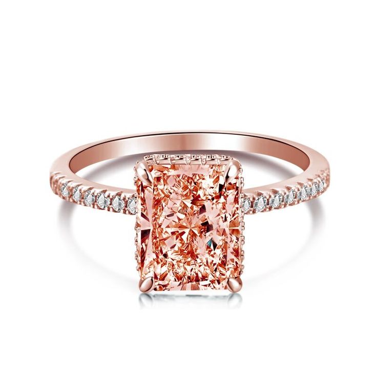 a pink diamond ring with diamonds around it