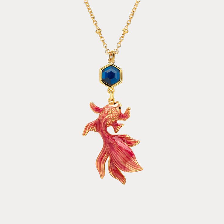 Selenichast Koi Pendant Necklace is a symbol for courage, overcoming adversity and strong character.This luxe Koi Necklace is a sophisticated piece of jewelry crafted with exquisite detail. Its unique enamel-coated design adds a hint of classic sophistication, sure to make you stand out with an air of luxury. DETAILS Plating: 18K Gold Materials: 18K Gold on brass, Enamel Measurements: Length: 16.54"(42cm) + Extender: 2.36"(6cm) Pendant Size:1.38''*0.63''(3.5cm*1.6cm) Weight: Symbol For Courage, Koi Necklace, Gold Pendant Necklace Jewellery, Necklace Stacks, Peach Necklace, Diamond Star Necklace, Anchor Jewelry, Luxury Details, Star And Moon Necklace