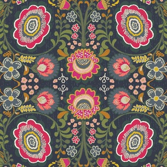 an image of a flowered fabric with many different colors and patterns on it, as well as a ruler