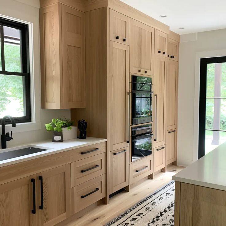 a kitchen with wooden cabinets and an oven in the center, along with a rug on the floor