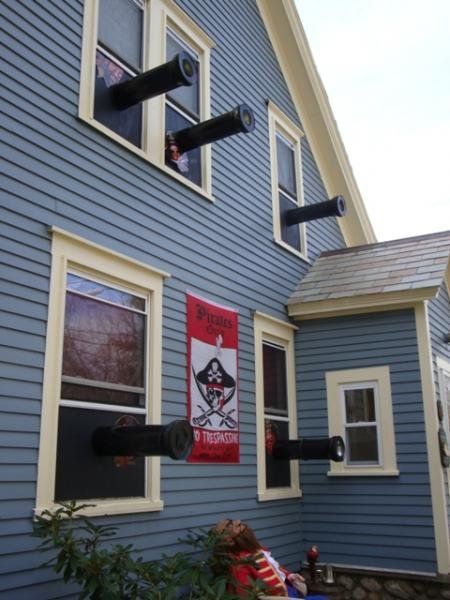 there is a blue house with two windows