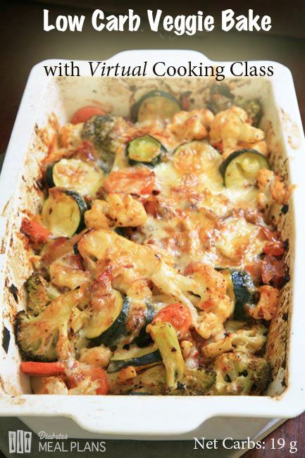 a casserole dish with zucchini, carrots, and other vegetables