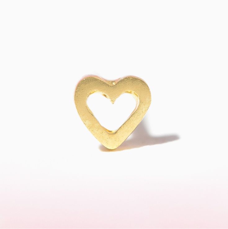 Elevate your ear stack with this delicate and minimalist stud showcasing a simple, dainty heart outline. Handcrafted in solid gold and perfect for everyday wear. Minimalist Heart Pendant Earrings For Everyday, Minimalist Everyday Heart Pendant Earrings, Minimalist Everyday Open Heart Earrings, Everyday Open Heart Earrings With Heart Charm, Everyday Yellow Gold Heart Earrings, Everyday Open Heart Earrings, Gold Minimalist Open Heart Earrings, Minimalist Yellow Gold Heart Earrings, Gold Open Heart Minimalist Earrings