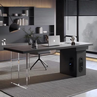 an office desk with a laptop on it in front of a bookcase and window