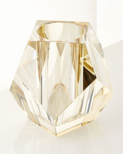 a crystal vase sitting on top of a white table