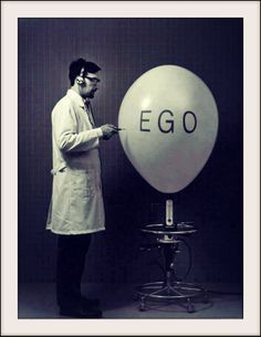 a man standing in front of an egg with the word ego written on it