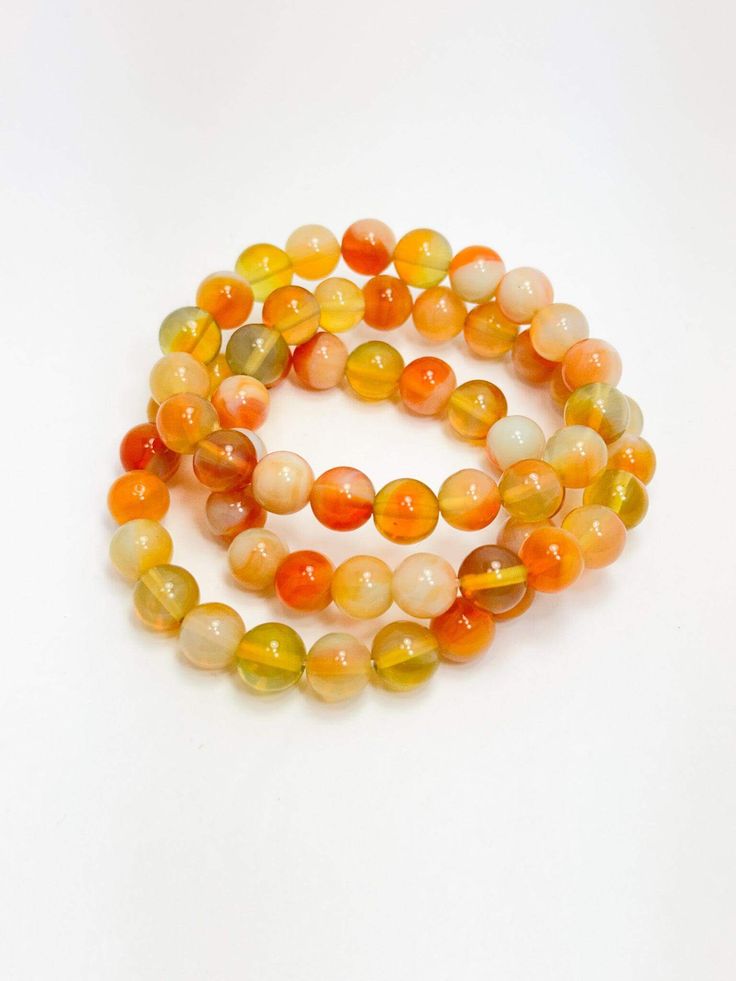 Citrus Beaded Stack Bracelets Orange Spiritual Beaded Bracelets, Adjustable Orange Beaded Spiritual Bracelet, Adjustable Orange Spiritual Beaded Bracelet, Spiritual Orange Adjustable Beaded Bracelets, Orange Bohemian Stretch Bracelet With Round Beads, Adjustable Orange Gemstone Bead Bracelet, Bohemian Orange Stretch Bracelet With Round Beads, Bohemian Orange Hand-strung Bracelets, Bohemian Orange Hand-strung Bracelet