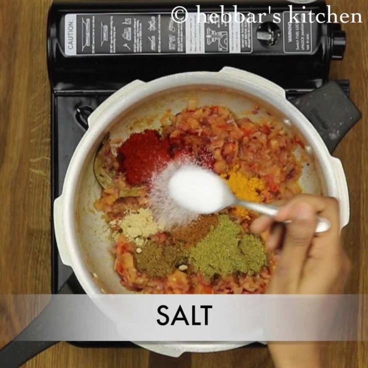 a person stirring ingredients in a pot on top of an electric stove with the words salt above it