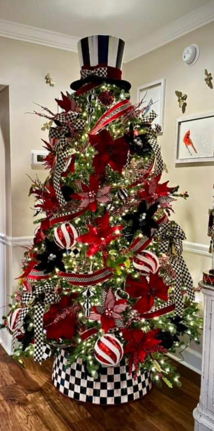 a christmas tree decorated with red, black and white ornaments