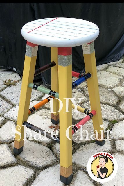 an upcycled stool made out of old crayon pencils and paint