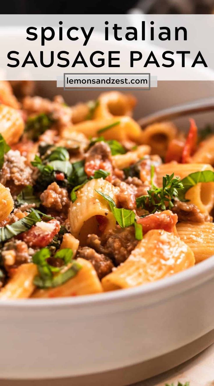 a white bowl filled with pasta covered in meat and cheese, garnished with parsley