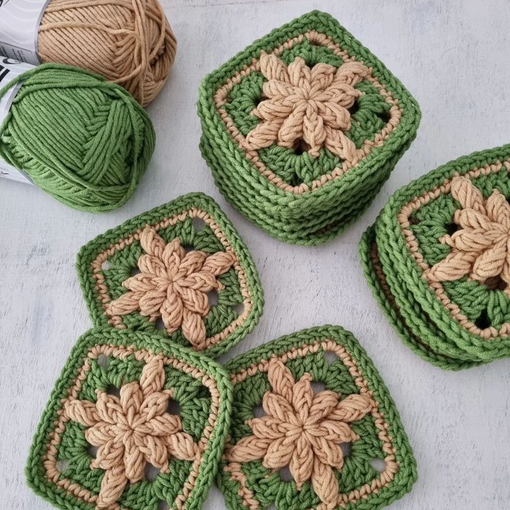 four crocheted grannys are sitting on the table