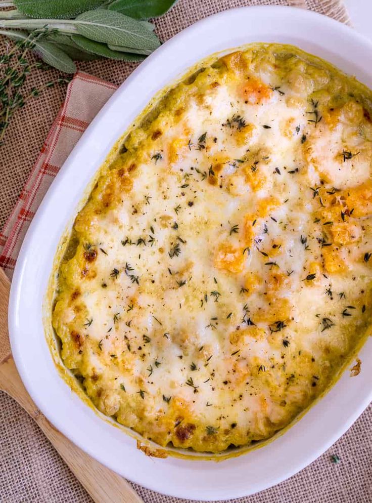 a casserole dish with cheese and herbs