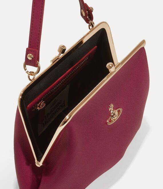 Our Granny Frame purse features a vintage-inspired silhouette and a kiss-lock closure, recalling antique coin purses from the early 20th-century. The piece receives a soft PU leather silhouette, complete with a saffiano-embossed motif to finish, enhanced with the house's orb plaque - synonymous with Vivienne's vision for taking tradition into the future. Elegant Red Coin Purse For Everyday Use, Affordable Elegant Red Coin Purse, Vivienne Westwood Granny Frame Purse, Everyday Red Leather Coin Purse, Elegant Red Coin Purse, Frame Purse, Antique Coins, Socks And Tights, Platform Pumps