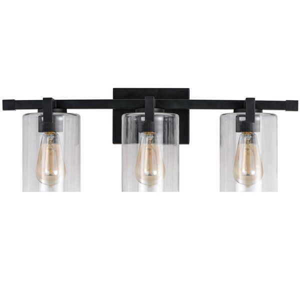 three light bathroom fixture with clear glass shades and black metal frame, on an isolated white background