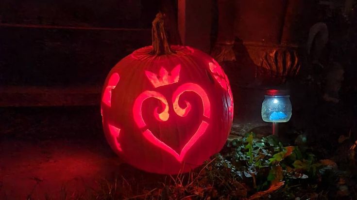 a pumpkin carved to look like a heart