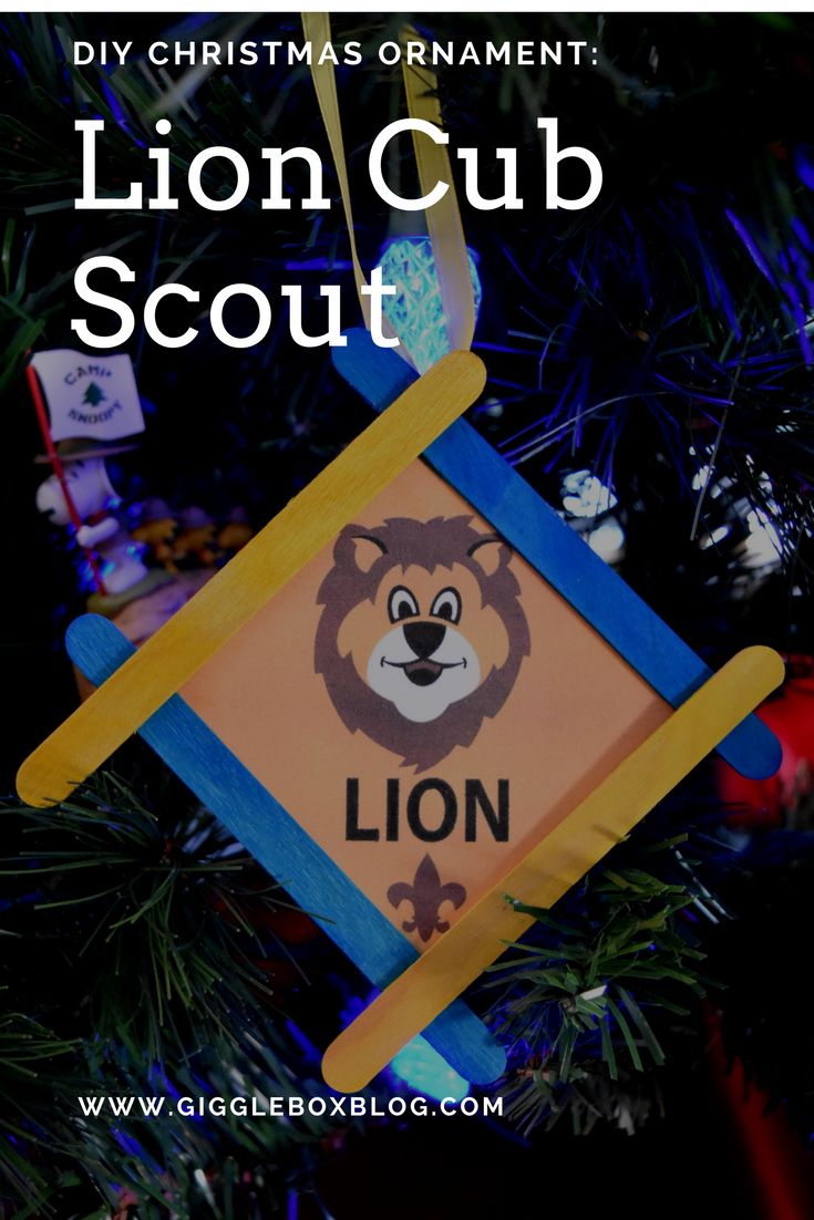 a lion ornament hanging from a christmas tree with the text diy christmas ornament lion scout