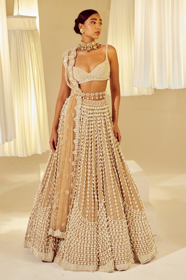 Beige attached cancan lehenga with all-over chandelier pearl embellishments. Comes with sleeveless pearl drop sweetheart neck padded blouse and a dupatta. - Aza Fashions Lehenga With Pearls, Vani Vats Lehenga, Pearl Blouse Designs, Pearls Blouse, Pearl Lehenga, Sari Blouse Styles, Beige Lehenga, Vani Vats, Cancan Lehenga