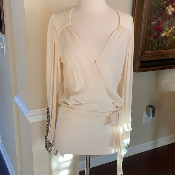 Stunning Silk Blouse By Haute Hippie. Sheet With Long Sleeves And Beautiful Bead And Sequin Accents At Bottom Of The Sleeve And Cuff. Covered Buttons. Waist Is Wrap Around And Also Has Double Snap Closures Inside For More Support. Absolute Gorgeous! Never Worn. Pristine Condition. Silk V-neck Blouse In Cream, Cream V-neck Silk Blouse, Beige Silk V-neck Top, Cream Silk V-neck Blouse, Cream Silk V-neck Top, Hippie Tops, Haute Hippie, Covered Buttons, Silk Blouse