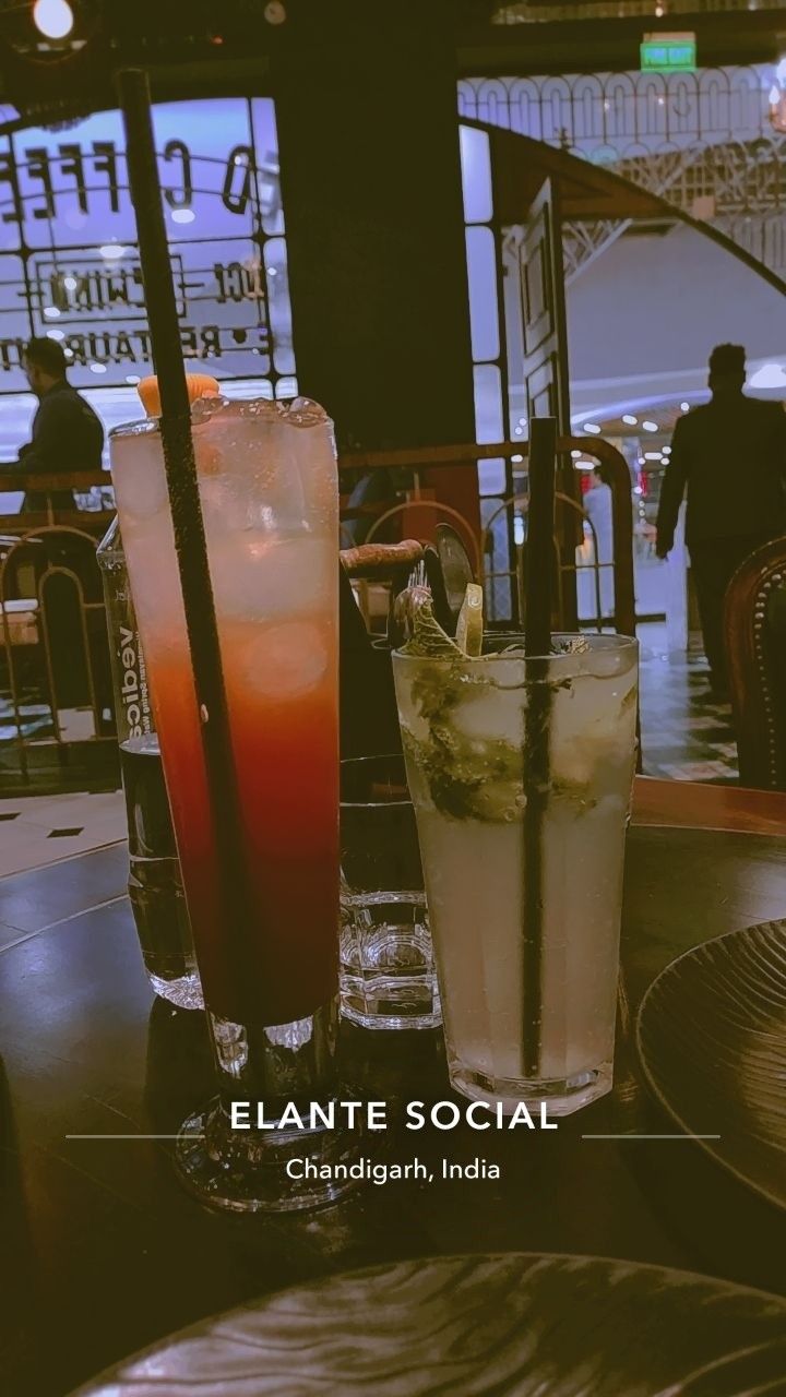 two drinks sitting on top of a table next to each other