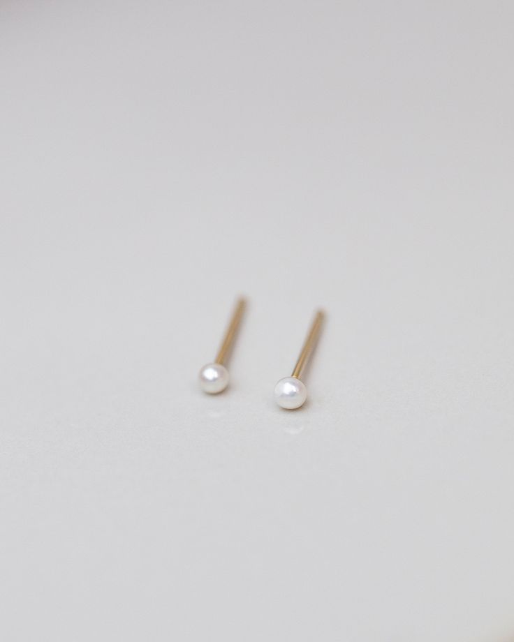 Mini Pearl Studs Perfect 14k gold smaller sized pearl studs for your everyday wear. Minimalist and elegant as a pair or as a single stud on your second or third ear piercing. 14k gold post and backings choose from 2 sizes: Smaller 1.75-2mm Small 2.75-3mm Tiny Elegant Pearl Earrings For Gifts, Minimalist Yellow Gold Pearl Earrings For Anniversary, 14k Rose Gold Pearl Earrings Gift, Delicate 14k Gold Pearl Earrings For Gift, Dainty Pearl Earrings For Anniversary, Dainty Rose Gold Pearl Earrings For Gift, Dainty Rose Gold Pearl Earrings As Gift, 14k Gold Pearl Earrings With Pearl Charm As Gift, 14k Gold Dainty Pearl Earrings For Anniversary