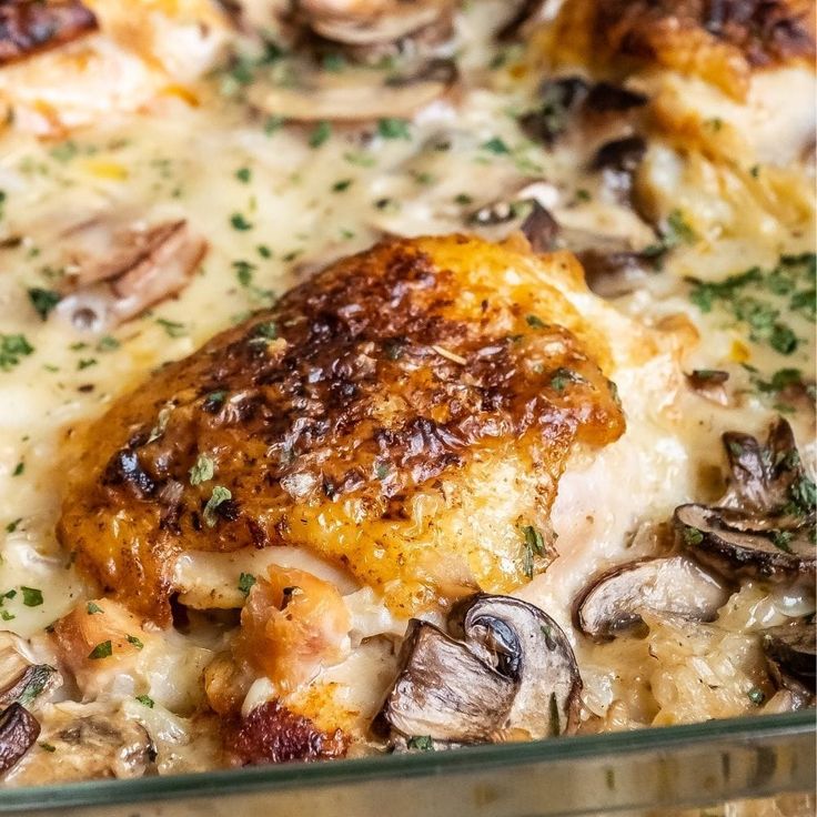 a casserole dish with chicken, mushrooms and cheese