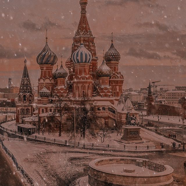 an old photo of a large building with domes on it's sides in the snow