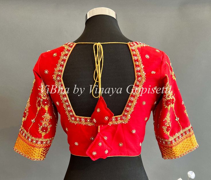 Blouse size: 38 All the Blouses have enough room to adjust to next two sizes above or below the standard size. Red Embroidered Zari Work Top For Wedding, Red Embroidered Top With Zari Work For Wedding, Bollywood Style Red Embroidered Top For Wedding, Red Embroidered Blouse For Wedding, Fitted Red Bollywood Embroidered Top, Red Embroidered Top For Wedding And Festive Occasions, Bollywood Style Red Embroidered Top, Red Embroidered Zari Work Top For Festivals, Red Embroidered Top With Zari Work For Festivals