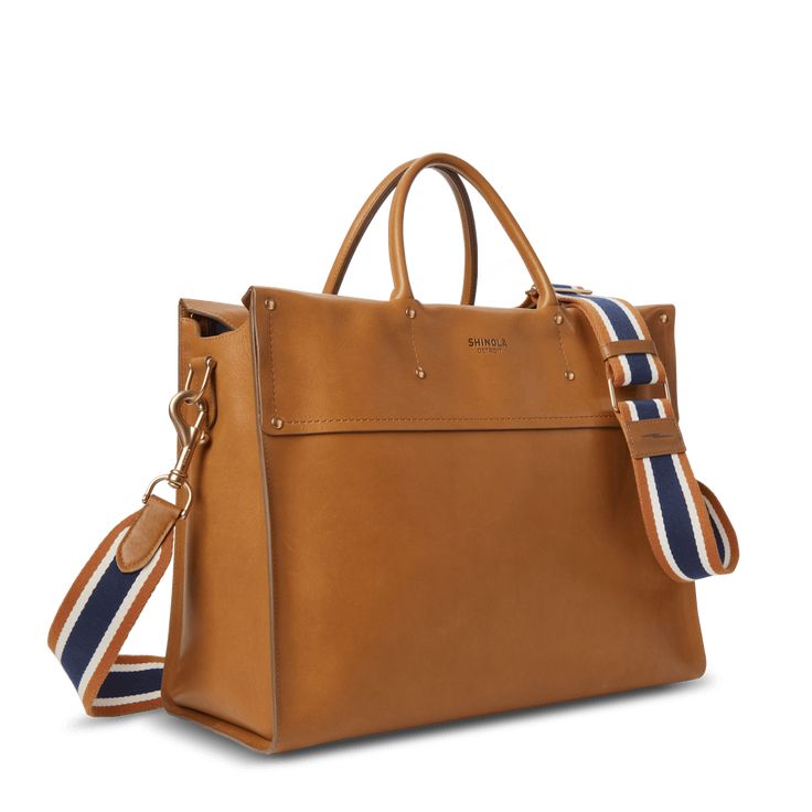 An expanded version of our bestselling Day Satchel, the Large Satchel is a versatile on-the-go bag that can handle the day’s work and tonight’s play, all at once. | Shinola Women's Large Satchel Bag in Tan Natural Leather Everyday Classic Box Bag With Detachable Strap, Classic Everyday Box Bag With Detachable Strap, On-the-go Tote Briefcase With Detachable Handle, Luxury Laptop Bag With Adjustable Strap For On-the-go, Classic Box Bag With Detachable Strap For Everyday, Classic Satchel With Detachable Strap For Everyday, Classic Everyday Satchel With Detachable Strap, Everyday Laptop Bag With Detachable Strap And Top Handle, Timeless Cognac Satchel For Travel