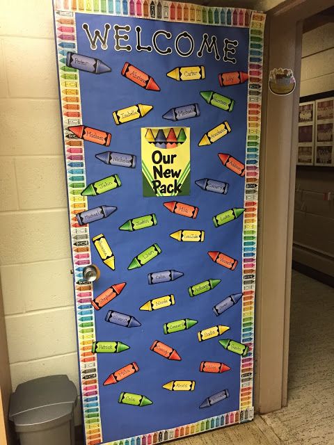 a door decorated with school supplies and the words welcome to our new teacher on it