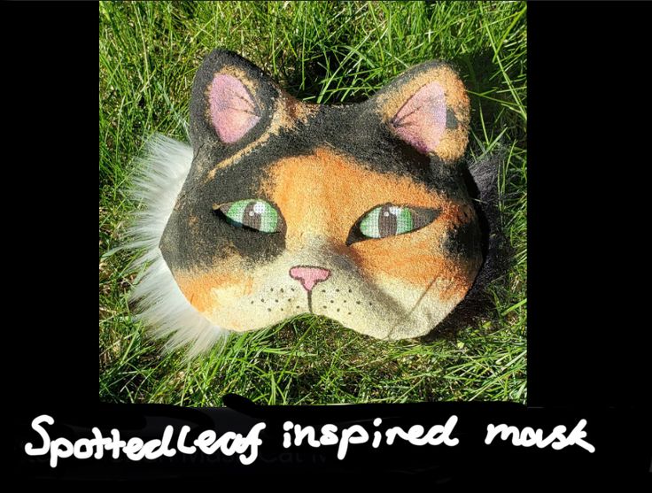 an image of a cat's head with the caption spotlighted inspired mask