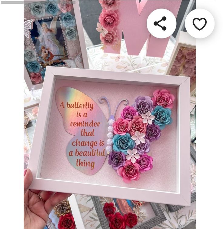 there is a pink frame with flowers in it and a butterfly on the inside that says, a butterfly is a reminder that change is a beautiful living