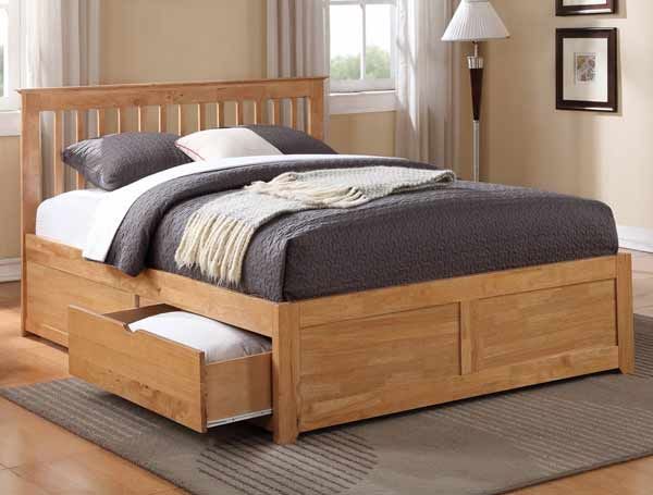 a wooden bed with two drawers underneath it