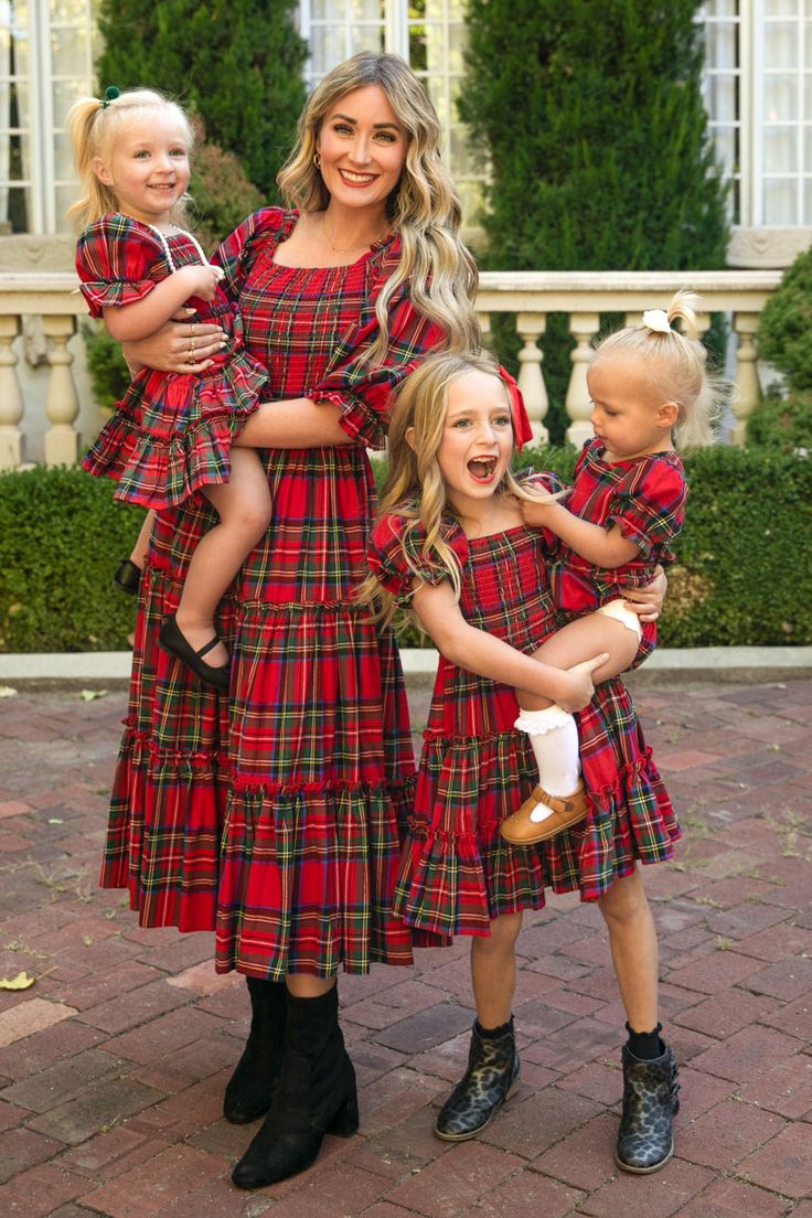 Flowy, darling, and winter princess approved. Everything this carefree midi-length girl's dress is made of. Inspired by holiday parties, family time, and playing with cousins or friends. Featuring a smocked bodice with puff sleeves, square neckline and ruffle detailing. Available for a limited time in our favorite festive print...HOLIDAY PLAID! Pregnant Christmas Dress, Matching Christmas Dresses, Mom Daughter Christmas Outfits, Tartan Holiday Outfit, Mom And Daughter Christmas Outfits, Tartan Dresses For Women, Teen Christmas Dress, Santa Pictures With Kids Outfits, Christmas Family Photos Outdoor Outfits