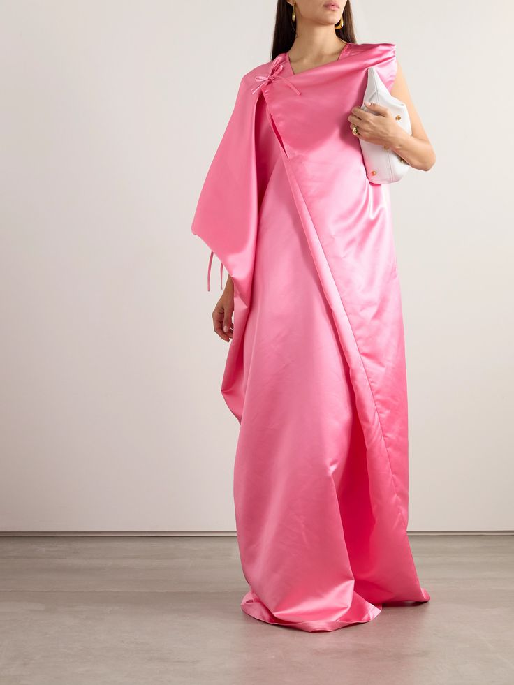 Marie Adam-Leenaerdt's kaftan-inspired dress has a breezy, loose fit and falls in draped folds to a maxi hem. Gold jewelry will complement the bubblegum-pink shade. Pre-draped Maxi Dress With Draped Sleeves, Elegant Draped Kaftan With Draped Sleeves, Spring Silk Maxi Asymmetrical Dress, Pink Floor-length Dress With Draped Sleeves, Pink Floor-length Dresses With Draped Sleeves, Spring Pre-draped Maxi Evening Dress, Elegant Silk Floor-length Kaftan For Evening, Spring Evening Pre-draped Maxi Dress, Spring Pre-draped Maxi Gown