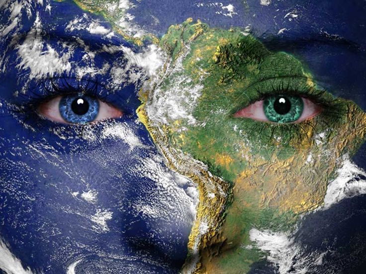 the earth has green eyes and is surrounded by clouds