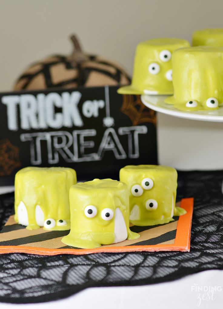 halloween treats with googly eyes are displayed on a table