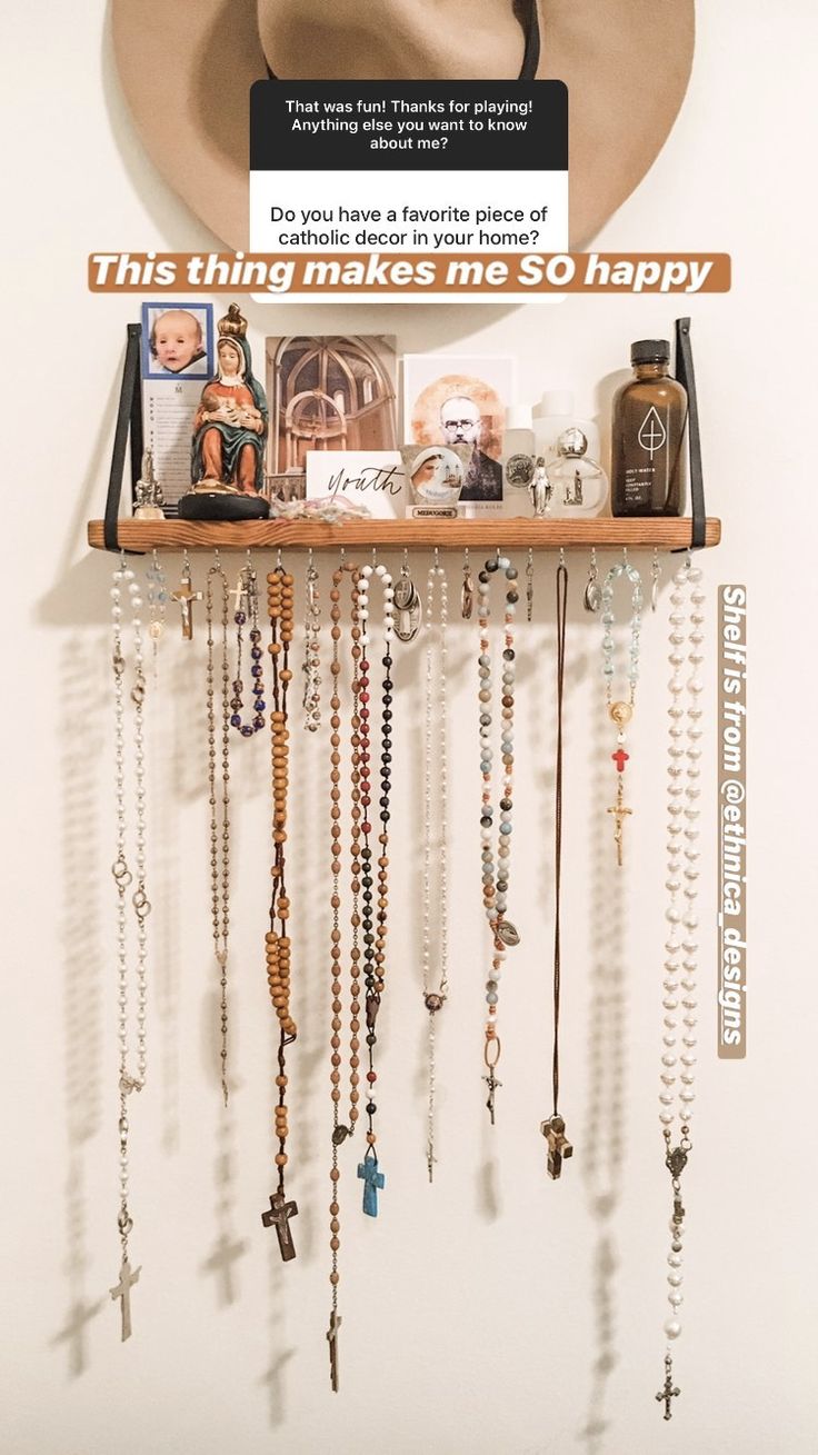 a hat is hanging on a shelf with many necklaces