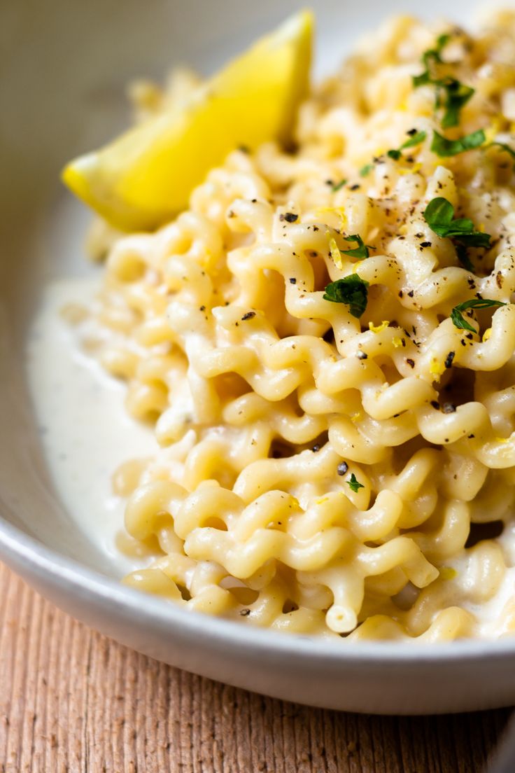 macaroni and cheese with lemon wedge on top