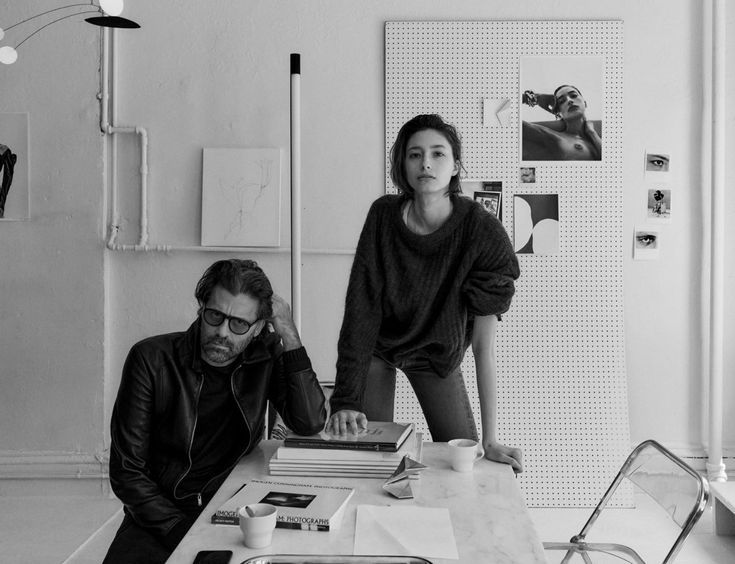 black and white photograph of two people sitting at a table