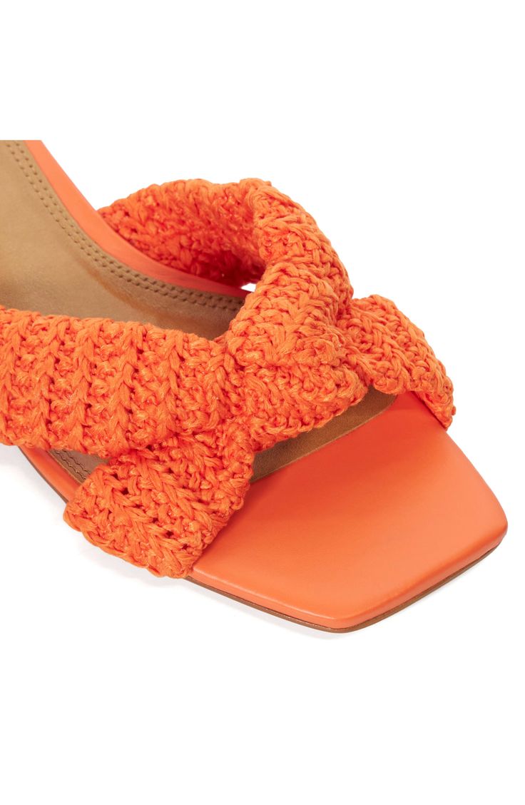 Knotted straps and a low block heel make this sandal the perfect complement to your contemporary look. 1 1/4" heel Synthetic upper, lining and sole Made in Brazil Orange Slingback Heels For Summer, Summer Mules With Wrapped Low Heel, Vacation Low Heel With Wrapped Heel, Low Heel Block Heels For Beach, Orange Synthetic Sandals With Wrapped Heel, Orange Sandals With Padded Block Heel, Synthetic Block Heels With Heel Strap For Beach, Orange Low Heel Sandals For Summer, Summer Orange Sandals With Wrapped Heel