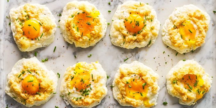 eggs and cheese are arranged on top of some sort of appetizer that's ready to be eaten