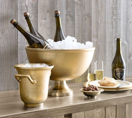 champagne bottles and ice buckets on a wooden table