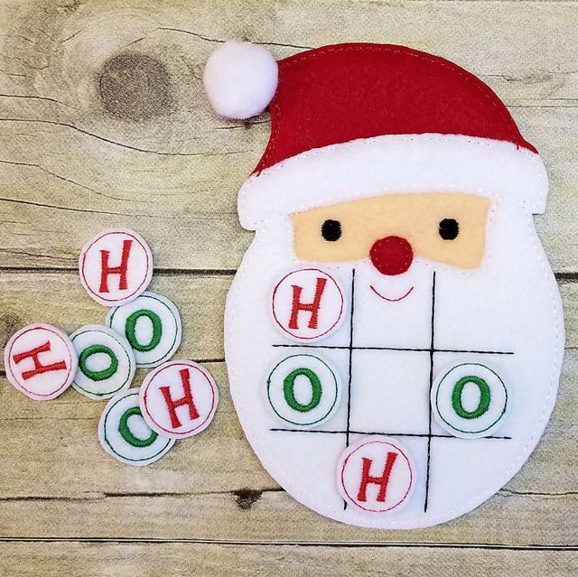 a christmas ticquet game with santa claus's hat on it and some buttons