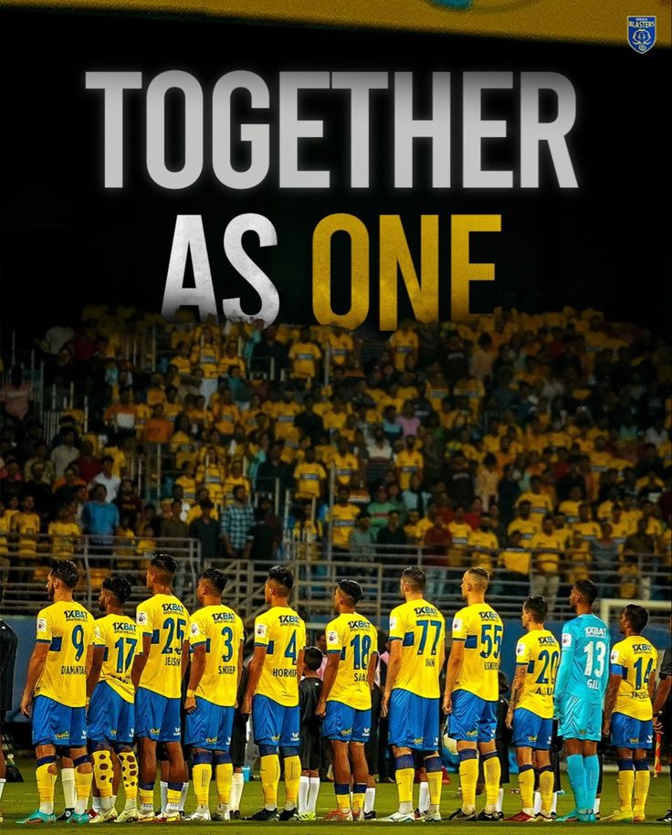 a group of soccer players standing together in front of a large sign that says together as one