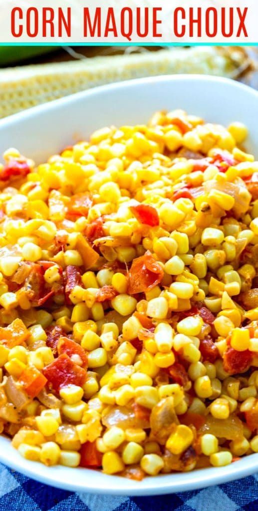 a bowl filled with corn and bacon on top of a blue checkered table cloth